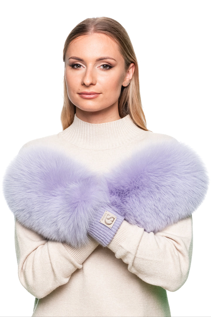 Pair of luxury women’s fox fur mittens in pastel purple, fluffy and warm real fur gloves with leather palms for winter and skiing.