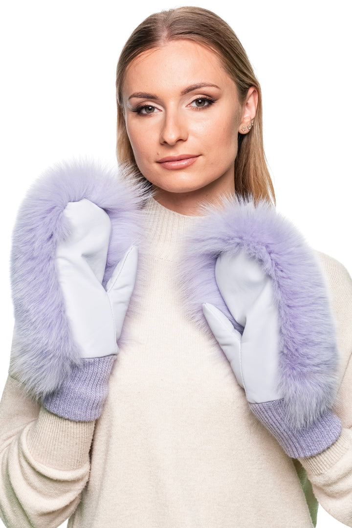 Close-up of fluffy purple fox fur ski mittens with soft leather underside, real fur gloves for women, luxury winter accessories.