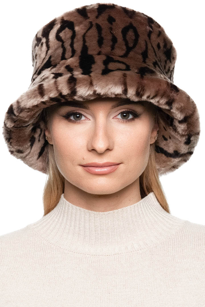 Front view of women’s shearling fur bucket hat in brown leopard print lamb fur, handmade luxury winter hat with wide bucket brim.