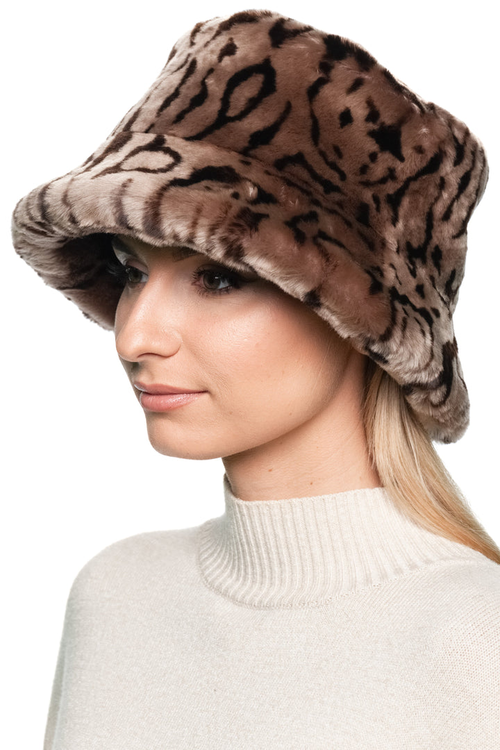 Side profile of leopard print shearling bucket hat for women, handmade lamb fur winter hat in vintage Panama style.