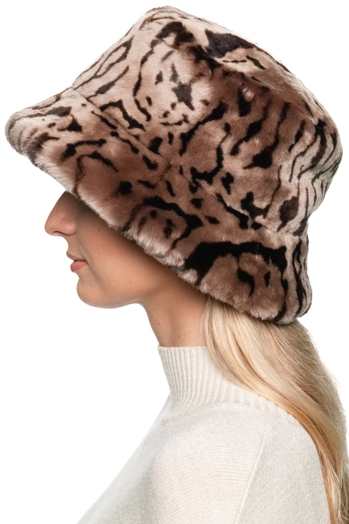Side view of women’s brown shearling fur bucket hat, handmade lamb fur winter hat with soft leopard pattern.