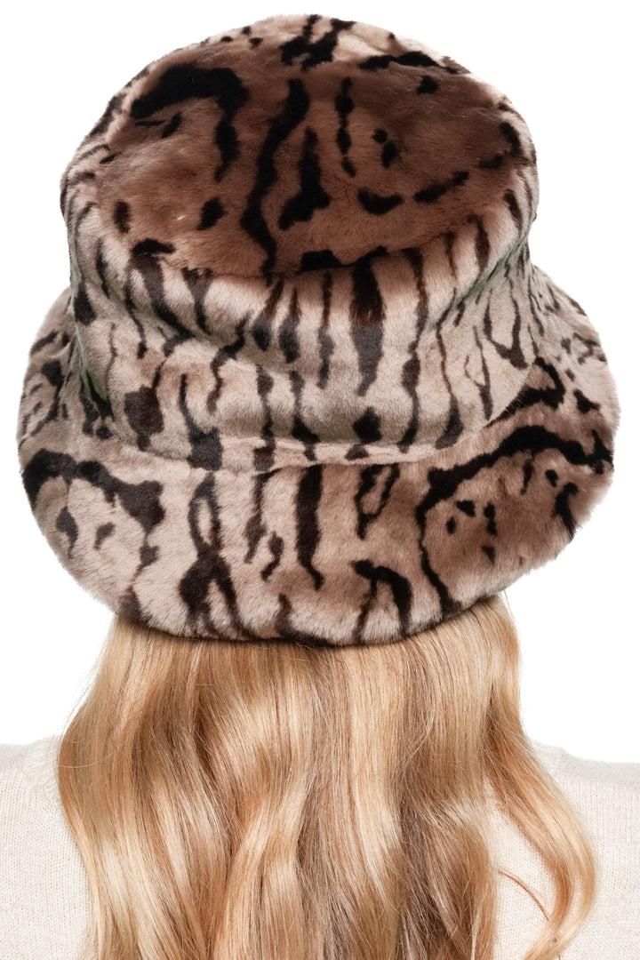 Back view of women’s shearling fur bucket hat, handmade leopard pattern lamb fur winter hat with wide brim.