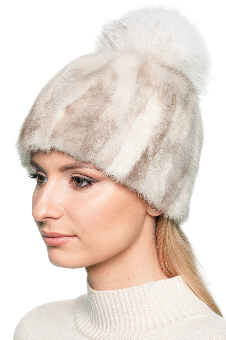 Model wearing light beige mink fur hat with fox fur pom pom, patchwork real fur winter beanie handmade for women, elegant and warm cold weather accessory.