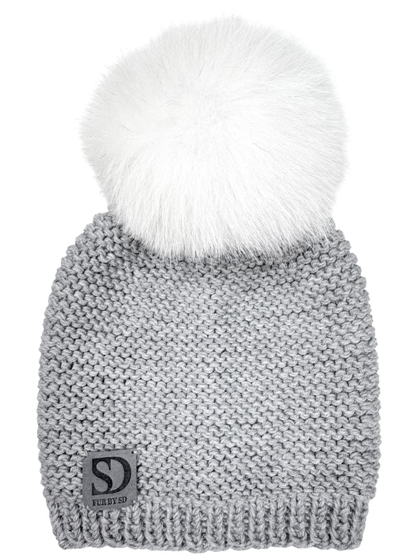 Gray merino wool knit beanie with white fox fur pom-pom on a white background.