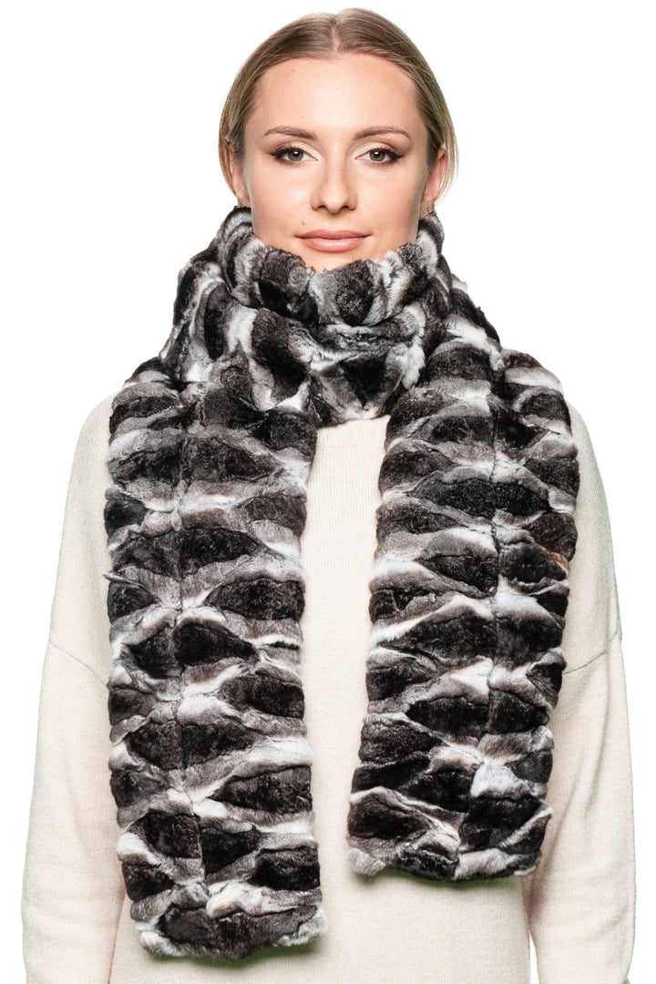 Model wearing a wide and long chinchilla fur scarf wrapped in front, fluffy lightweight fur accessory, handmade luxury fashion piece for winter by FurbySD.