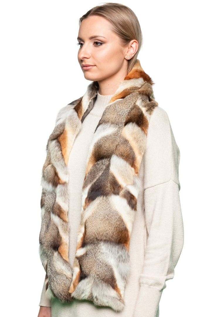 Elegant woman styling red fox fur patchwork scarf folded for warmth, lightweight genuine fur accessory for winter fashion.