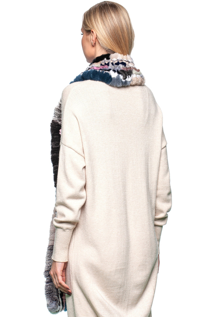 Back view of a woman wearing a multicolor rex rabbit fur knit scarf, showcasing luxury and style.