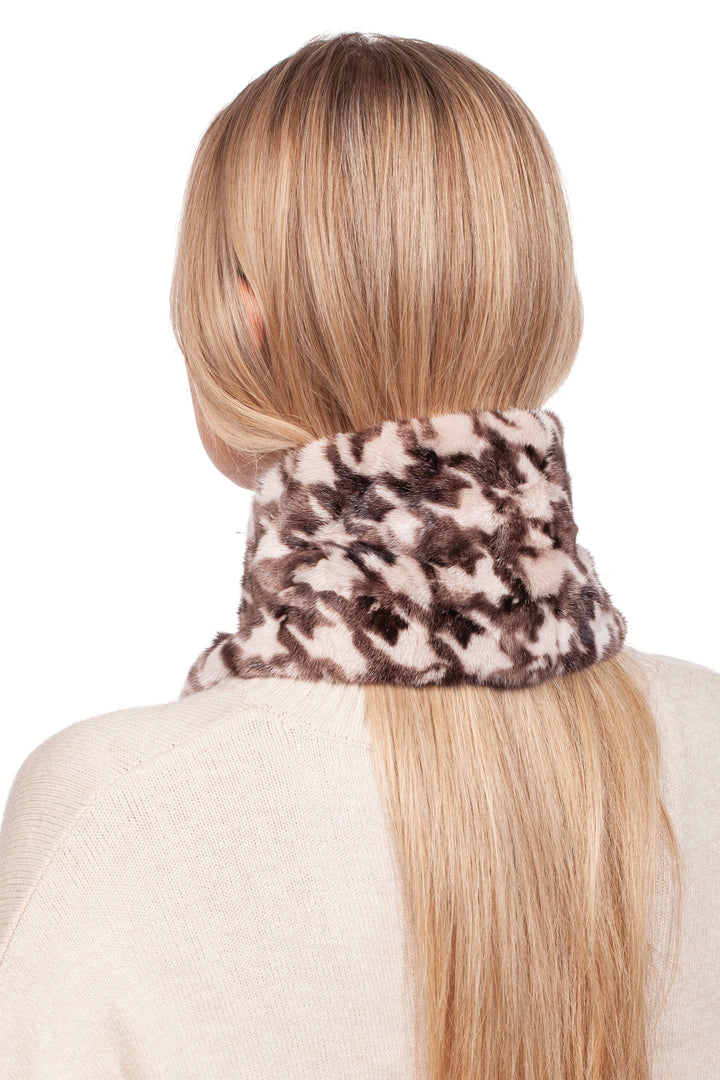 A woman with long blonde hair is seen from behind, wearing a cream-colored sweater and draping a luxurious Houndstooth Mink Fur Scarf With Keyhole by FurbySD around her neck.