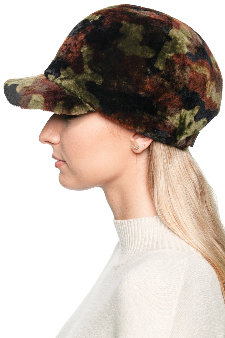 Side profile showing camouflage lambskin cap with curved brim, unisex real fur army hat offering thermal insulation and durable outdoor wear.