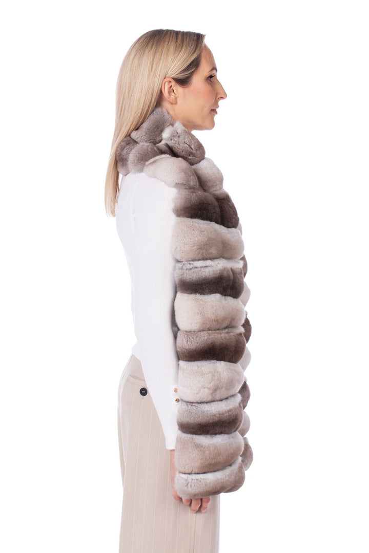 Elegant woman wearing a luxurious chinchilla fur shawl