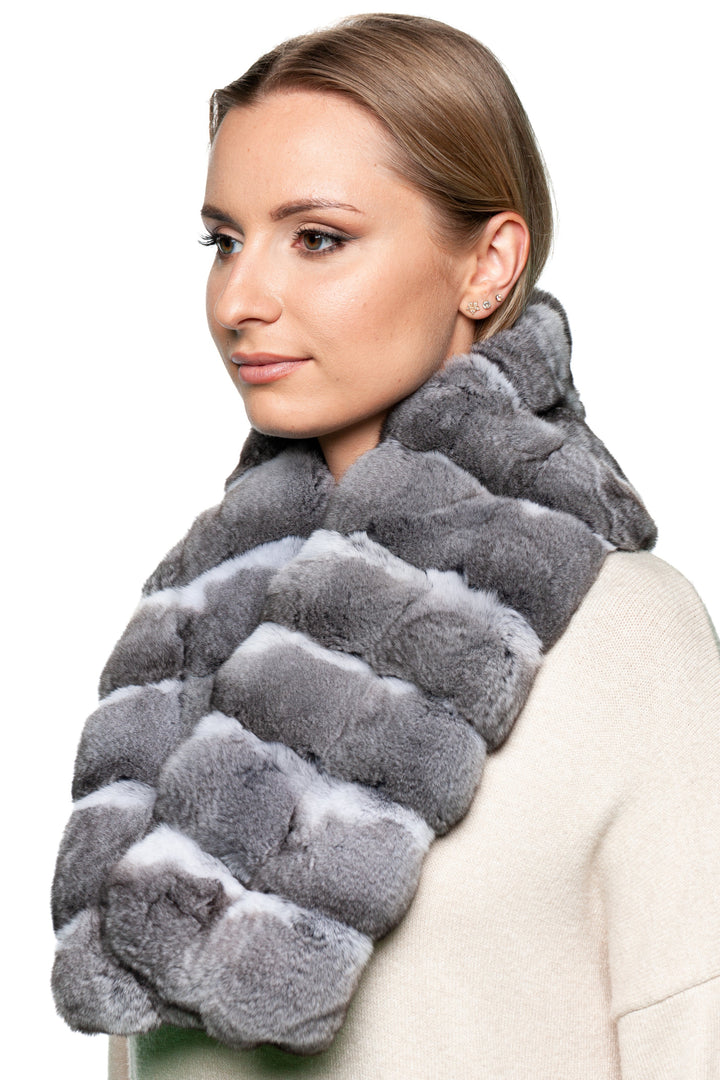 Close-up of genuine chinchilla fur scarf in natural grey tones, silky soft texture with subtle color variations, handmade luxury winter gift for her.