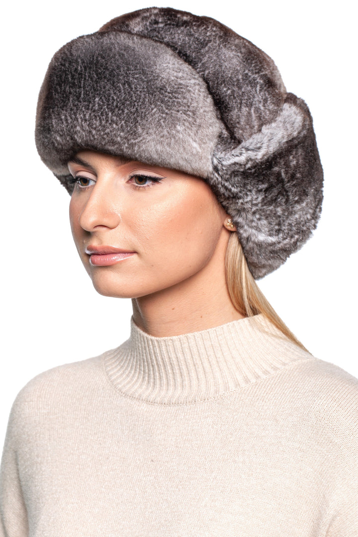 Woman wearing a luxurious Grey Rex Rabbit Fur Ushanka Hat, showcasing its plush texture and classic design.