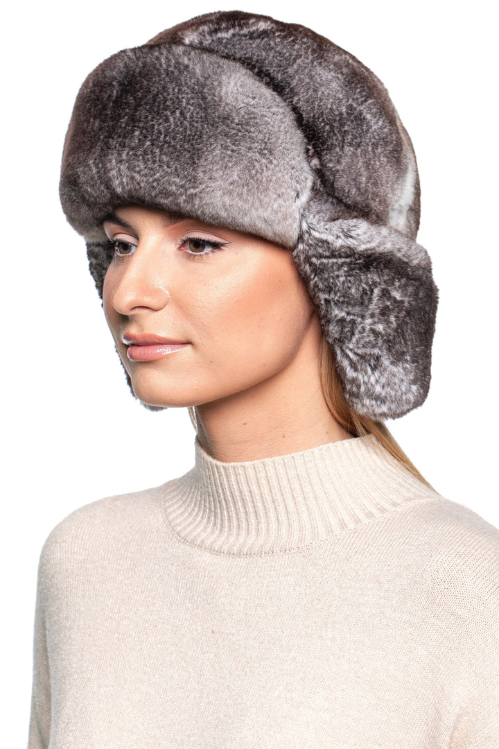 Stylish woman wearing a Grey Rex Rabbit Fur Ushanka Hat, showcasing its luxurious softness and traditional design.