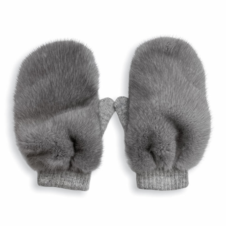 A pair of luxurious winter accessories, the Sapphire Mink Fur Flip Top Mittens by FurbySD, placed side by side on a white background. These grey mittens boast a soft, fluffy exterior with ribbed cuffs at the wrist, offering both style and warmth.