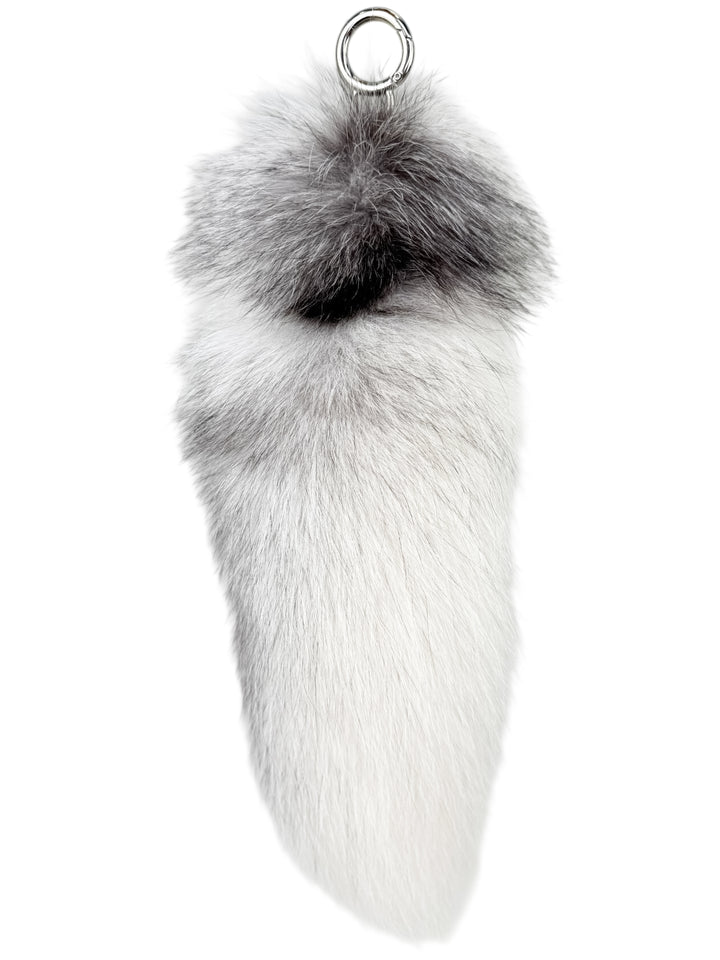 Side view of fluffy fox fur bag charm in shadow frost white — handmade real fur accessory with soft plush texture, designed by FurbySD.