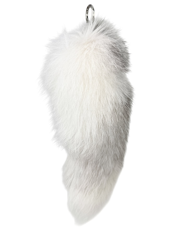 Close-up of fluffy real fox fur bag charm in shadow frost white — handmade luxury accessory with silver clasp, perfect for handbags or keychains.