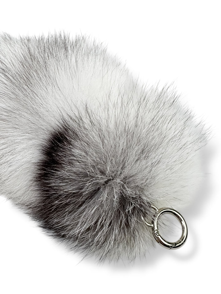 Fluffy white and gray fox fur keychain charm with metal clasp — handmade luxury bag accessory by FurbySD, perfect for winter fashion gifts.