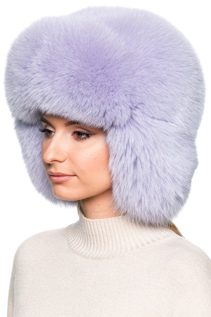 Close-up of purple fox fur trapper hat – oversized ushanka style with plush earflaps, luxury unisex winter fashion hat.