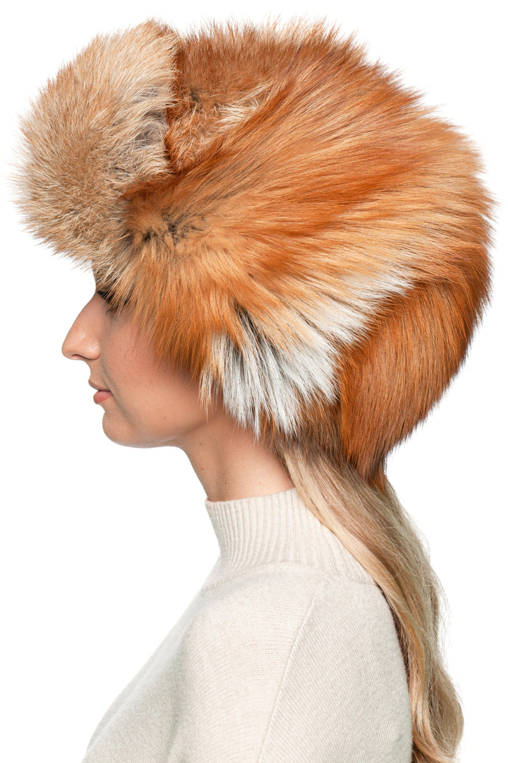 Side profile of red fox fur ushanka trapper hat, real fur Russian winter ski hat with natural orange and white tones, handmade by FurbySD.