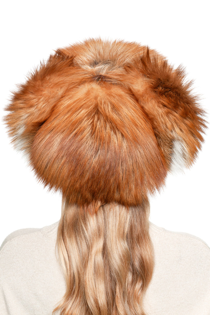 Back view of red fox fur ushanka trapper hat showing fluffy crown and full fur coverage, luxury Russian winter ski shapka.