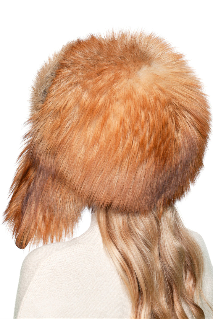 Back view of natural red fox fur ushanka hat, fluffy oversized trapper cap for extreme cold, handmade luxury Russian shapka.