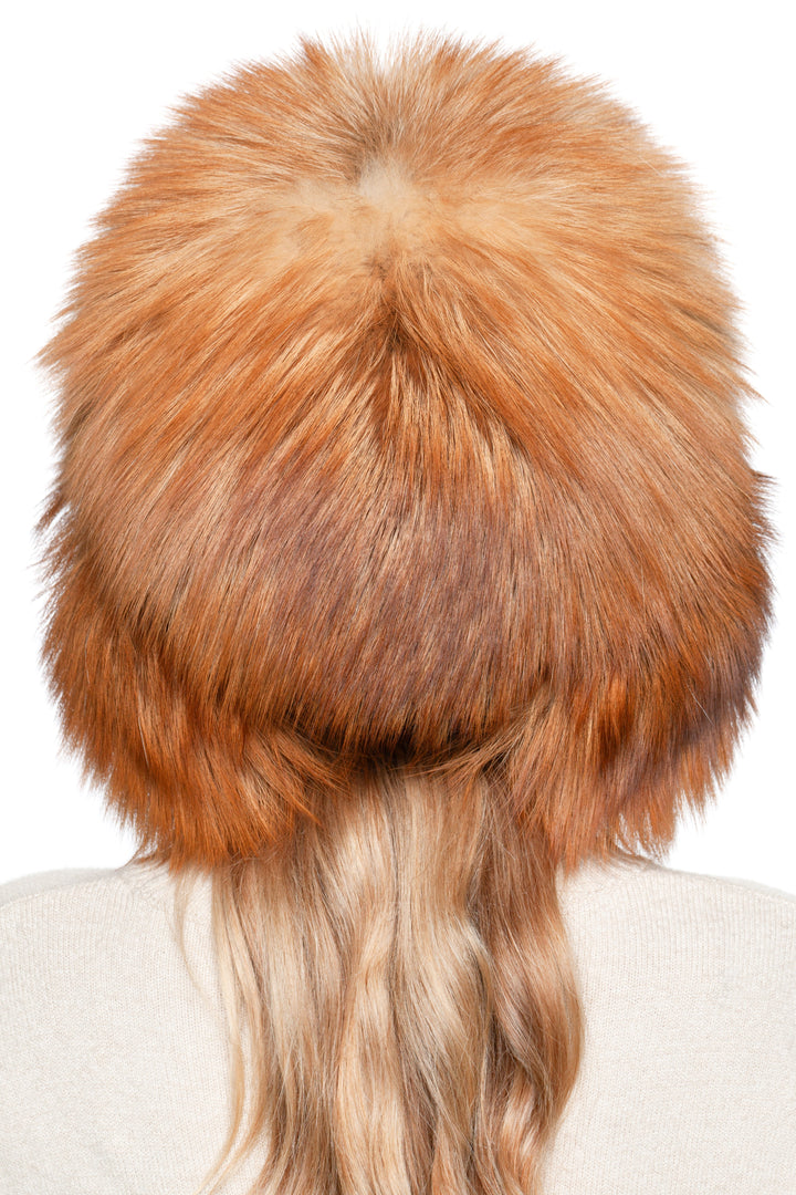 Back of red fox fur winter hat, authentic real fur ushanka with thick fluffy crown and warm insulation.