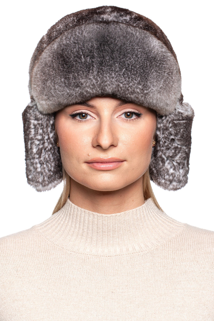 Woman wearing a luxurious Grey Rex Rabbit Fur Ushanka Hat, showcasing its stylish design and soft fur.