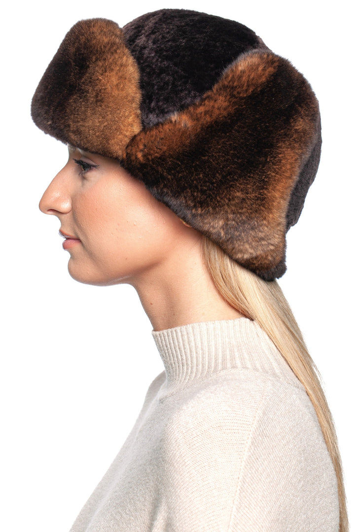 Brown lamb and Rex rabbit fur trapper hat worn by a model, showcasing its luxurious design and warmth.