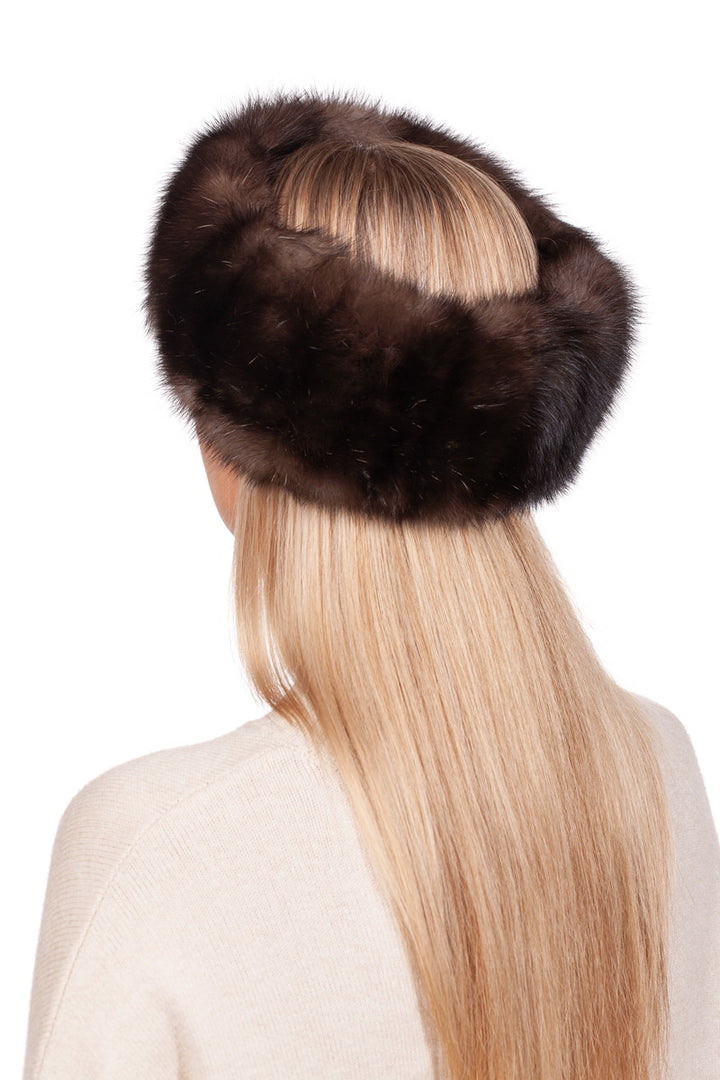 An individual with long blonde hair is wearing a luxurious FurbySD Russian Sable Fur Headband, handcrafted in Lithuania. They are facing away from the camera, dressed in a light-colored top, against a plain white background.