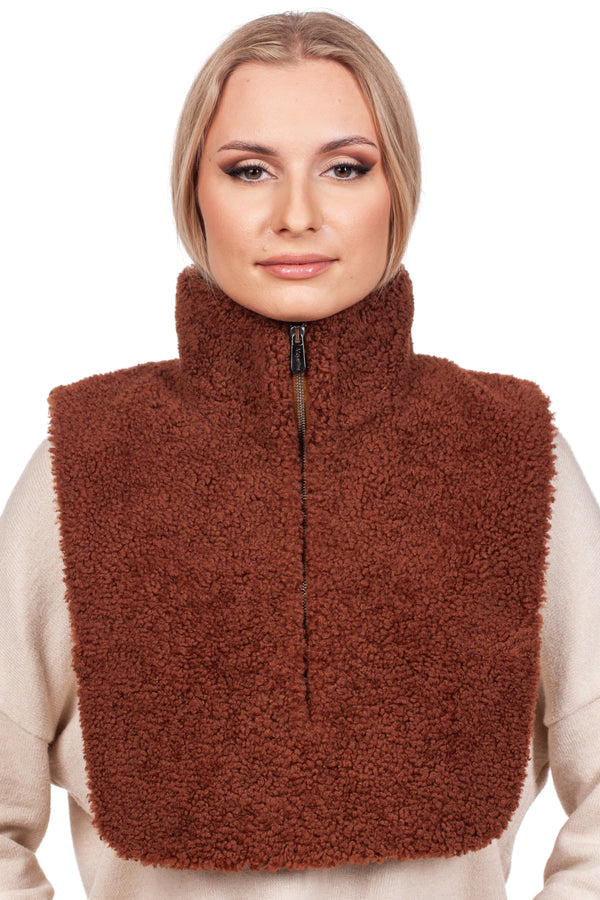 A person wearing a beige sweater is showcasing the Brown Shearling Fur Turtleneck Collar by FurbySD against a white background. This handmade accessory, made of textured fur, elegantly covers the shoulders and upper chest. The individual features light makeup and neatly styled hair.