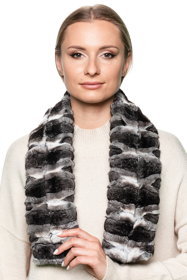 Elegant chinchilla fur scarf draped around shoulders, luxury fashion accessory perfect for winter weddings, evening events, and luxury gifting.
