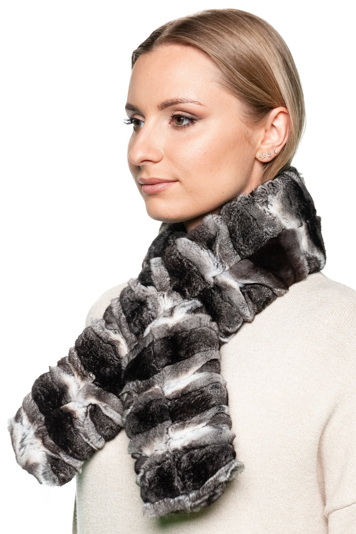 Women’s real chinchilla fur scarf styled loosely over shoulders, reversible two-sided design, luxury winter accessory for evening wear and gifting.