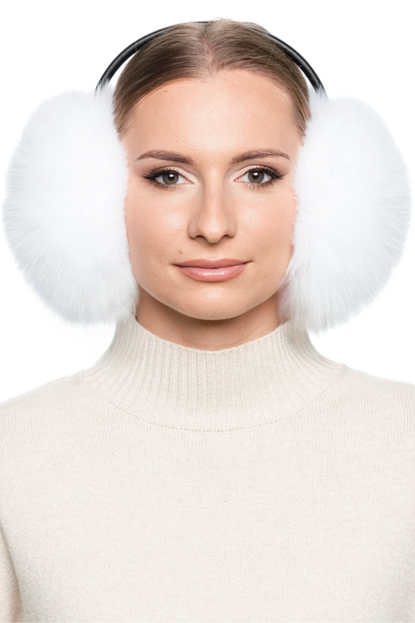 Luxury real fur earmuffs in white fox fur, warm and cosy winter accessory with adjustable leather band.