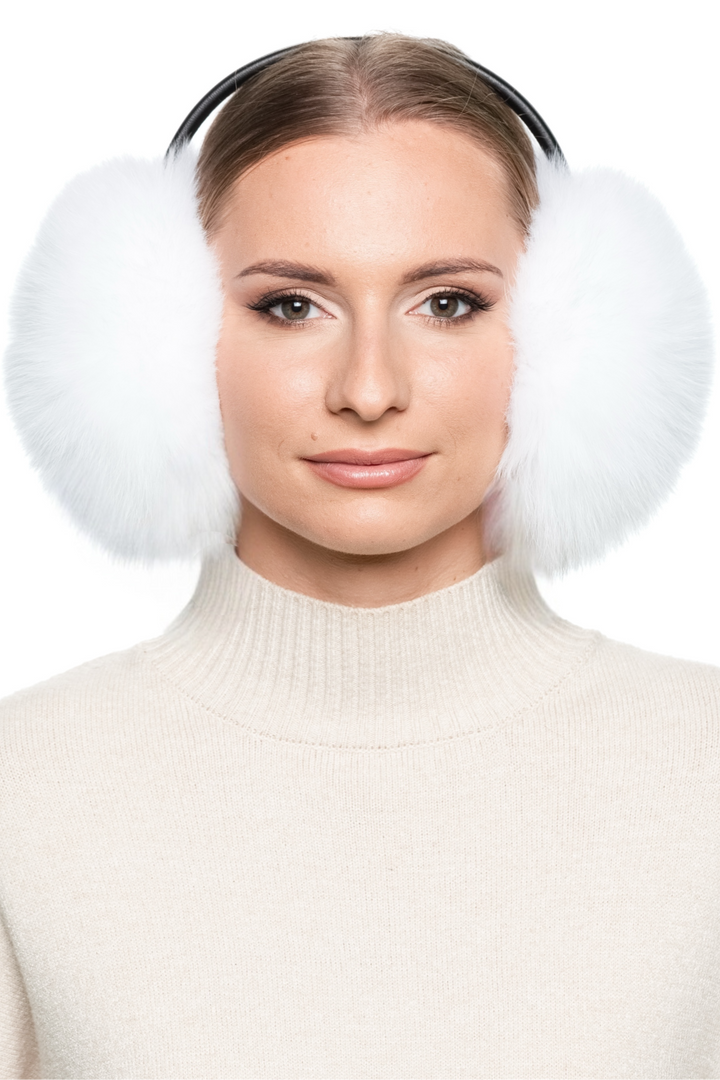 Luxury real fur earmuffs in white fox fur, warm and cosy winter accessory with adjustable leather band.