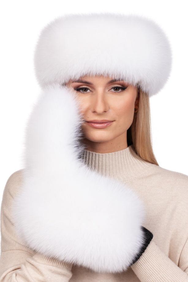 A person dressed in a beige sweater displays the "White Fox Fur Mittens And Headband Set" by FurbySD, featuring a luxurious, fluffy white headband and matching mittens. The plain white background emphasizes the opulent texture of this winter accessory set.