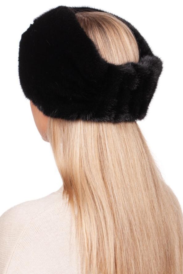 With long blonde hair seen from the back, an individual exudes winter luxury wearing the FurbySD Black Mink Fur Headband. This elegant faux fur accessory covers the ears and part of the head, providing a striking contrast against a light-colored top.