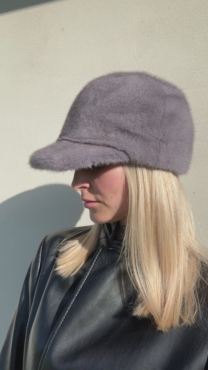 Side angle view of grey mink fur baseball cap with brim — luxury unisex winter hat handmade by FurbySD.