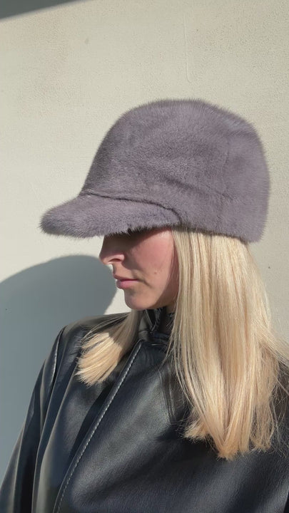 Side angle view of grey mink fur baseball cap with brim — luxury unisex winter hat handmade by FurbySD.