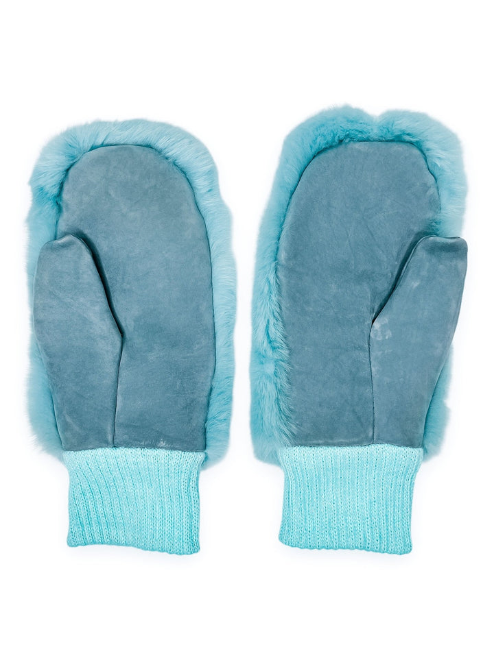 The Chinchilla Fur And Leather Mittens in Blue by FurbySD, featuring fuzzy edges and knitted cuffs made from ethically sourced fur, are laid flat against a white background.