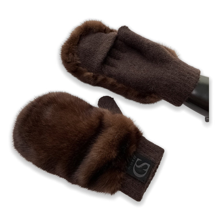 The Real Mink Fur Mittens by FurbySD are displayed. These dark brown mittens, crafted primarily from a blend of cashmere and wool yarn, feature an exquisite trim of real mink fur around the edges. One mitten is depicted showing the top view, while the other shows the palm side.